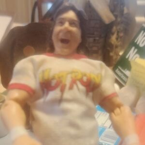 WWE Action Figure with White and Red Attire